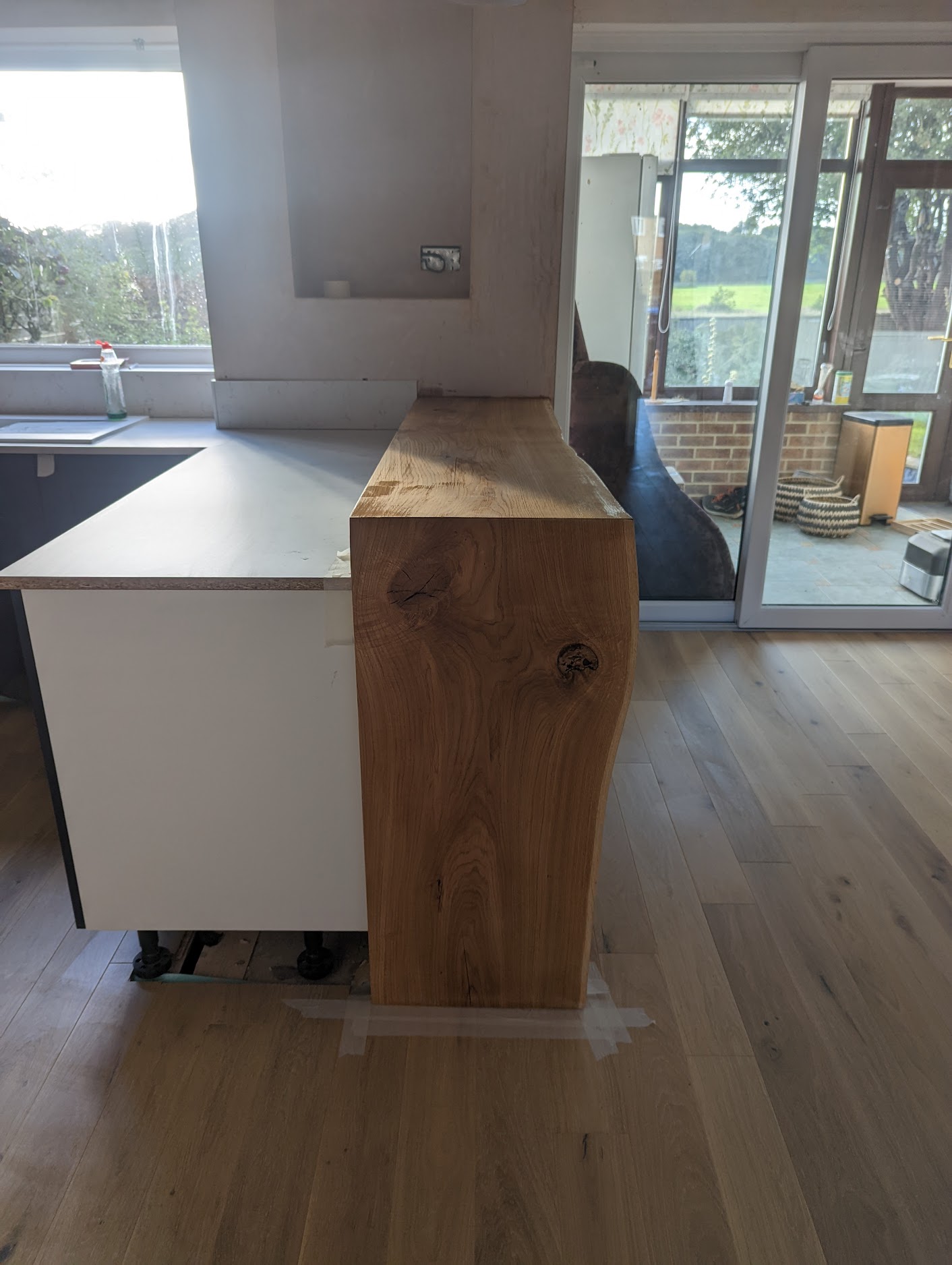This feature 'waterfall' breakfast bar was created using one piece of 40mm thick solid oak by our owner who is also our head installation engineer.  